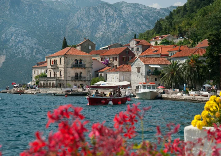 Stone buildings and boats on the waterfront at Perast