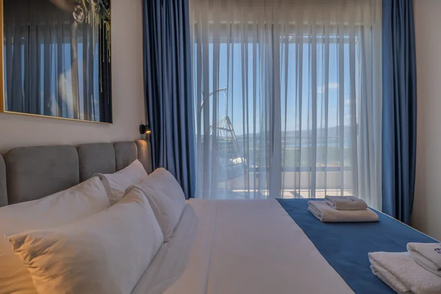 Royal Blue — bedroom opening towards a terrace